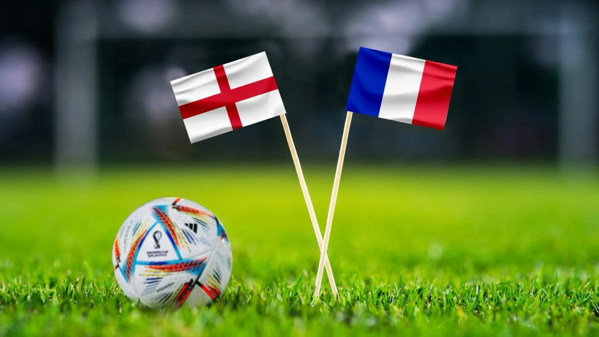 England and France flags beside a World Cup football on the pitch