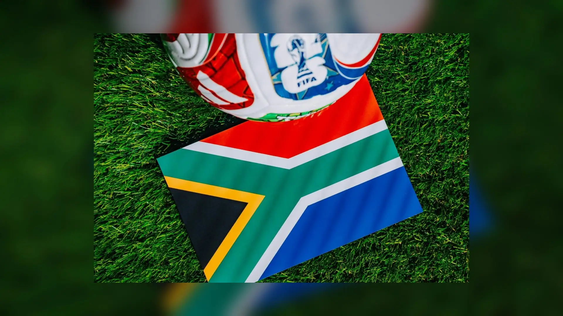 South African flag beneath a FIFA World Cup football