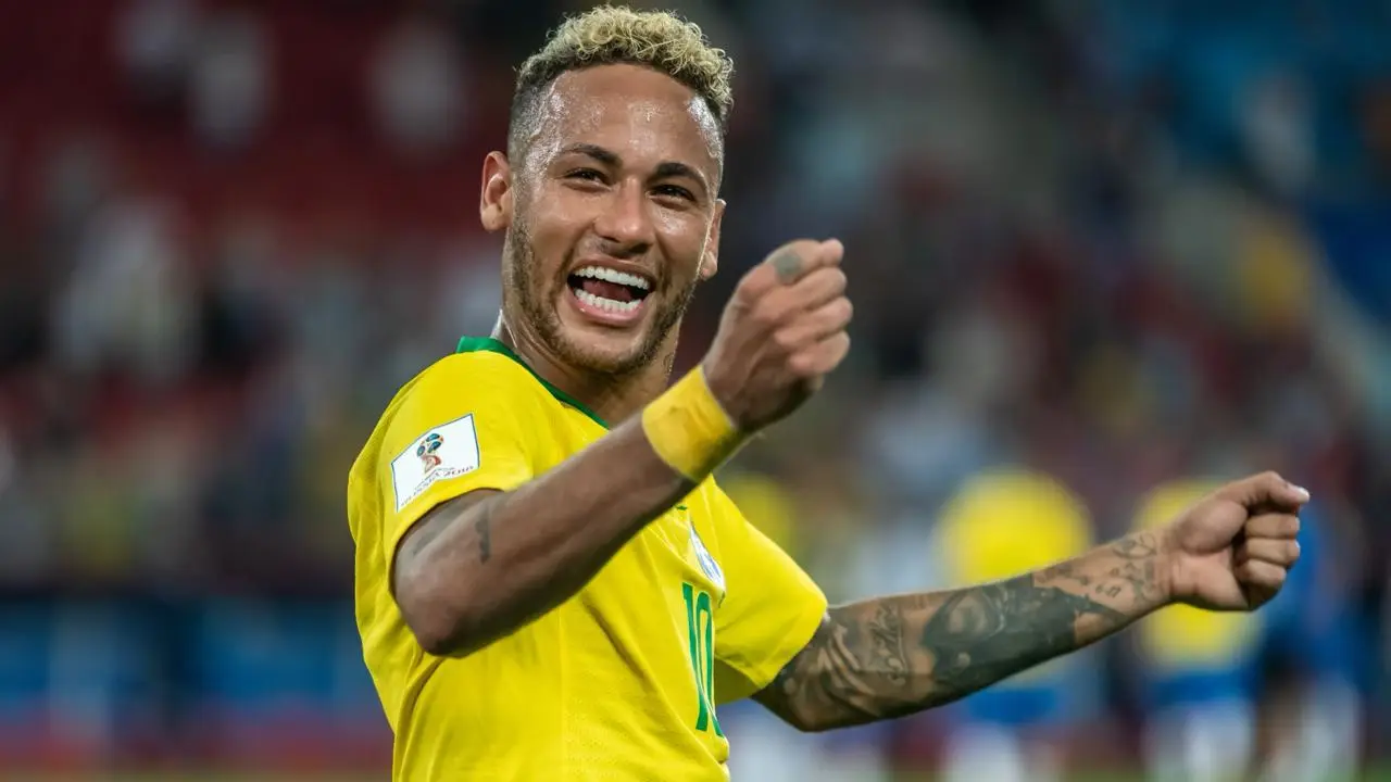 Neymar smiling in Brazil’s yellow No. 10 shirt