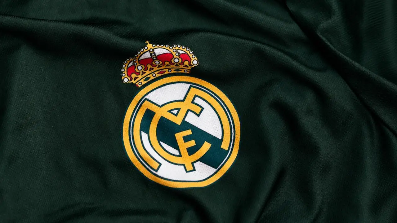 Real Madrid crest embroidered on the dark green 2026/27 away shirt