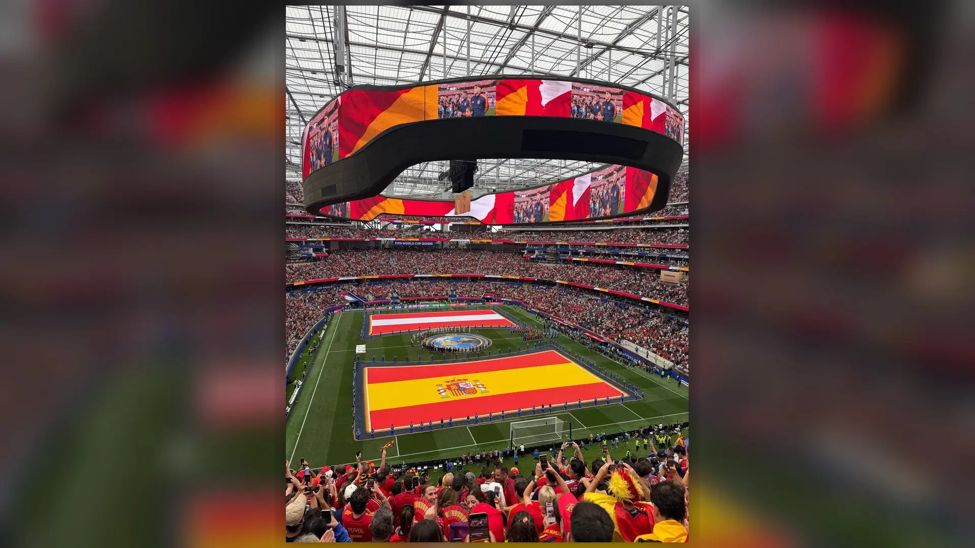 Spain and Austria flags cover the field before their World Cup Round of 32 match in Los Angeles