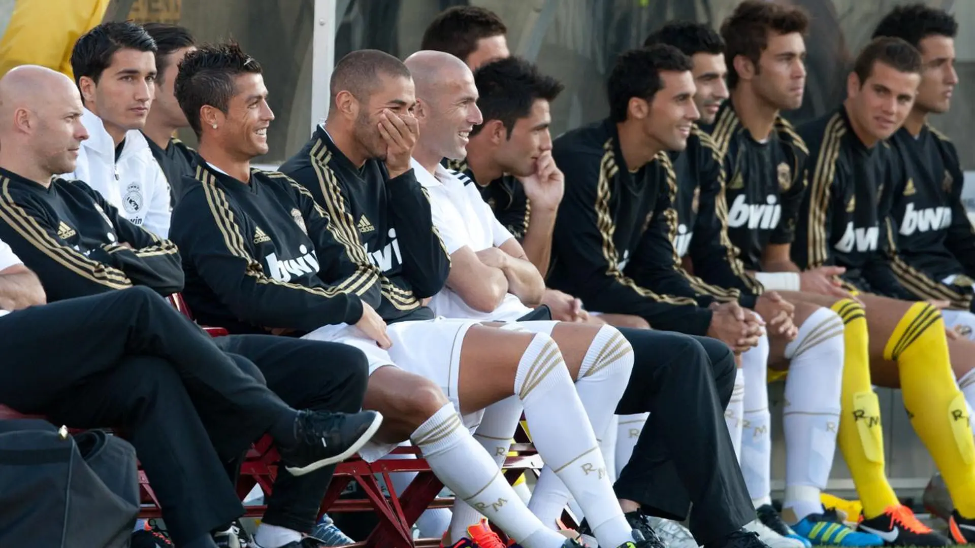 Zinedine Zidane, Cristiano Ronaldo, Karim Benzema and Real Madrid teammates seated on the bench