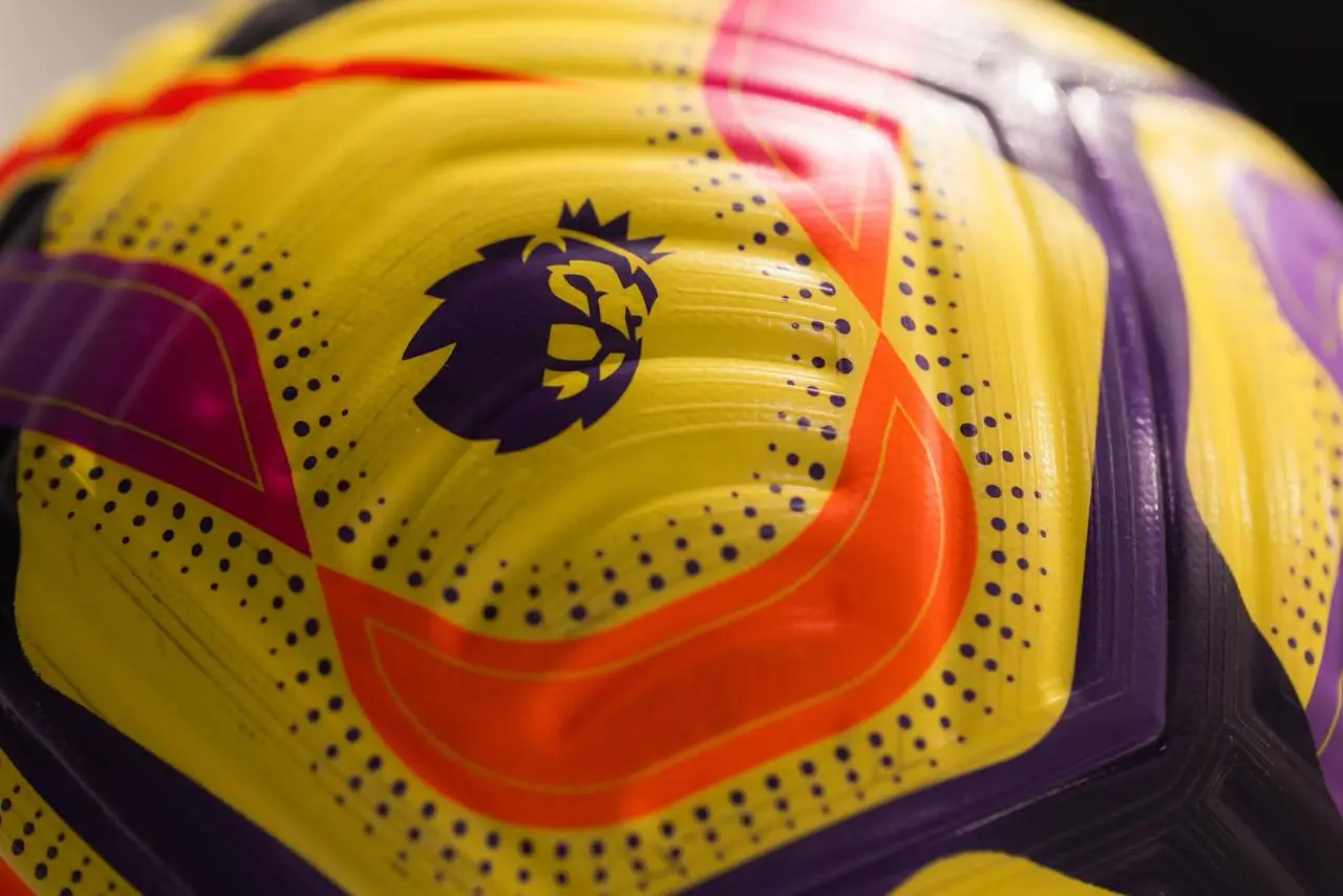 Close-up of a yellow Premier League soccer ball with the league lion logo