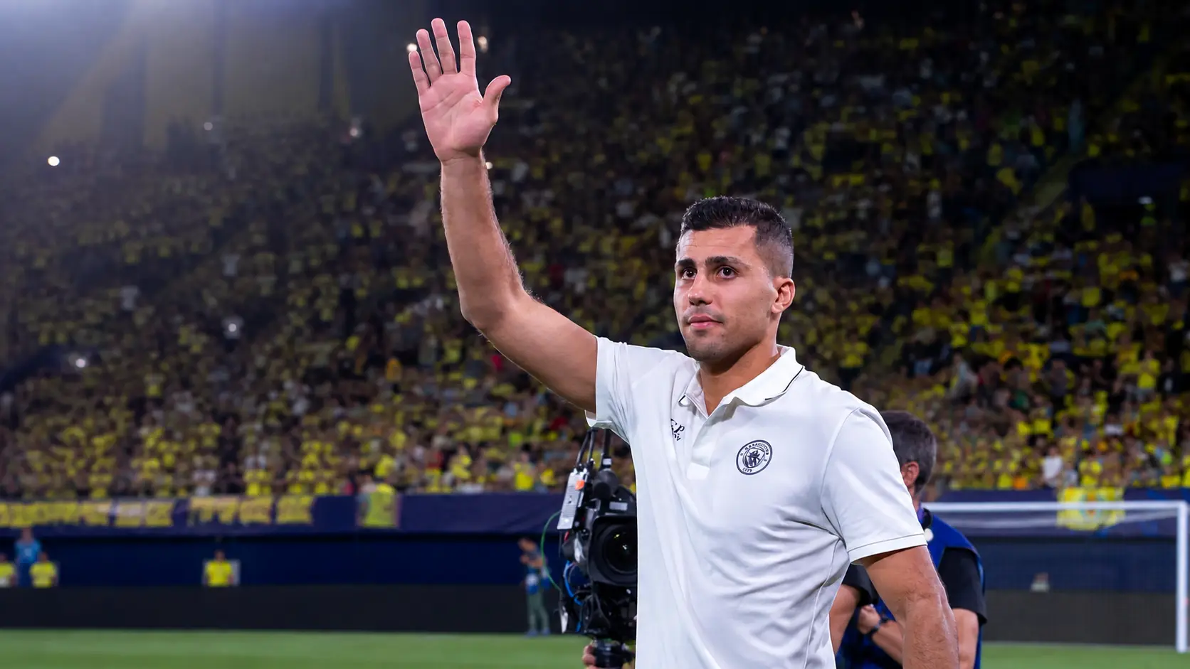 Rodri signs for Barcelona, pictured waving to supporters in Manchester City gear