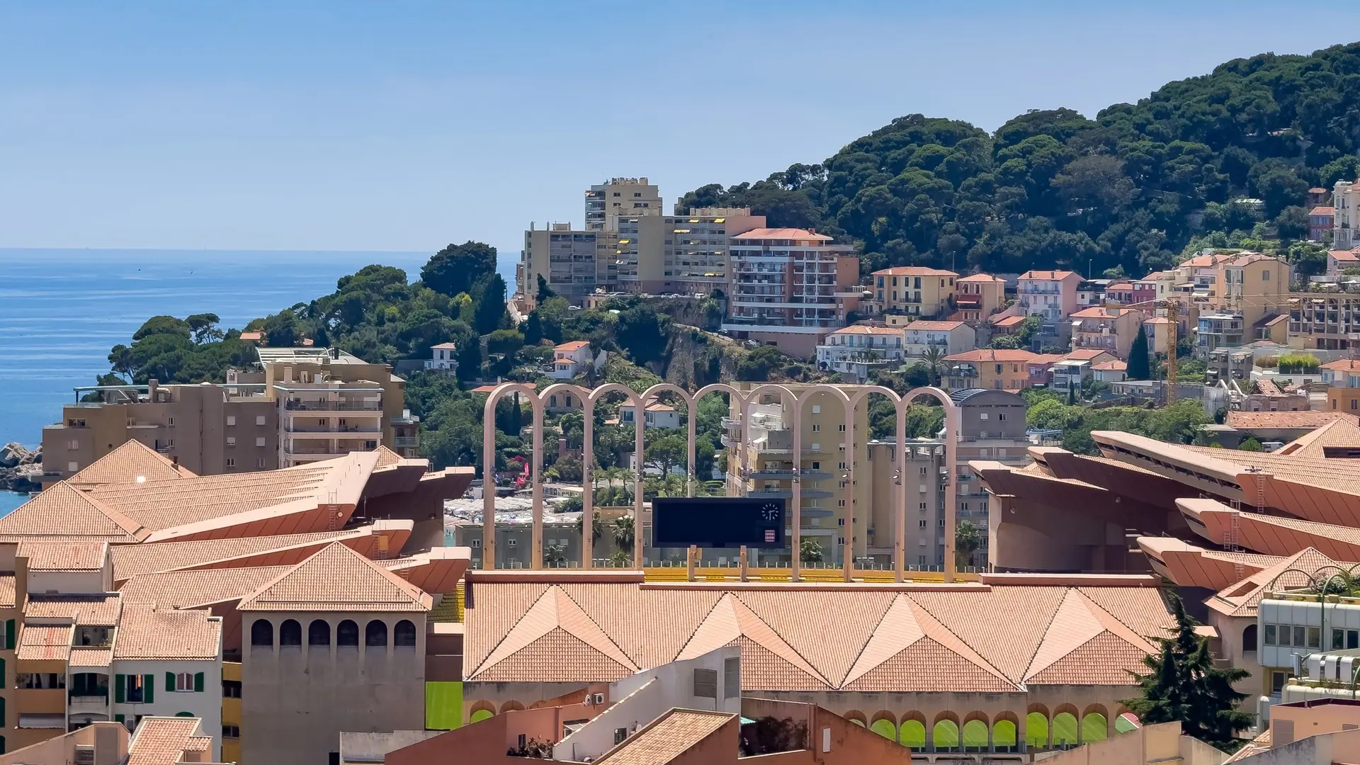 The Grimaldi Forum and Monaco coastline beside the Mediterranean Sea