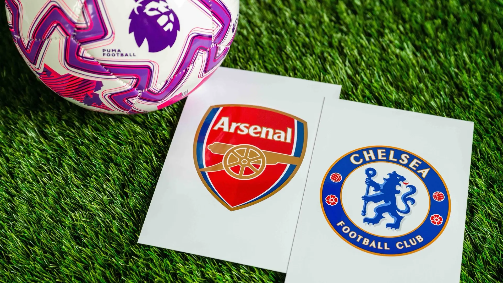 Arsenal and Chelsea crests beside a Premier League ball