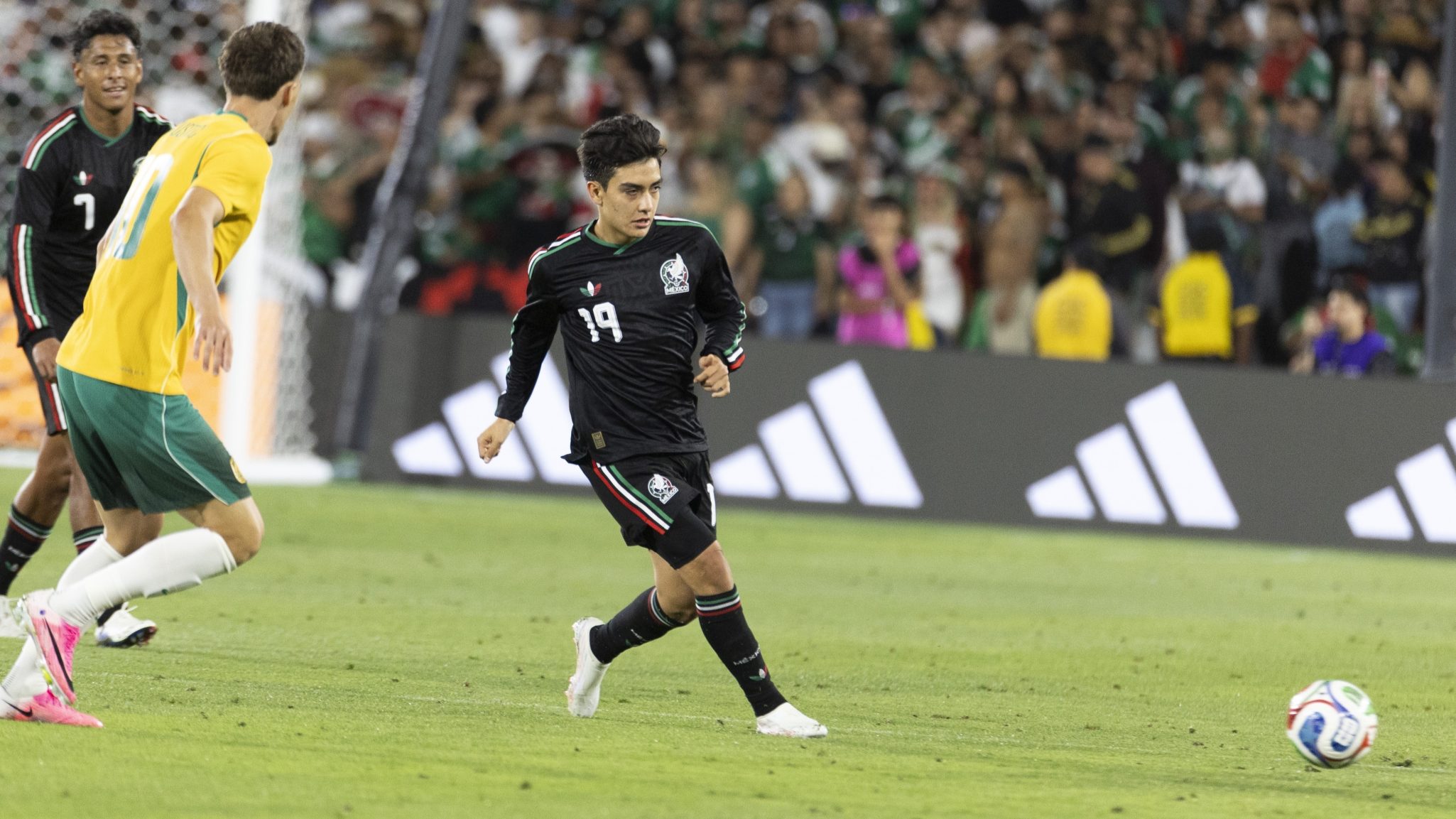 Gilberto Mora controls the ball for Mexico against Australia