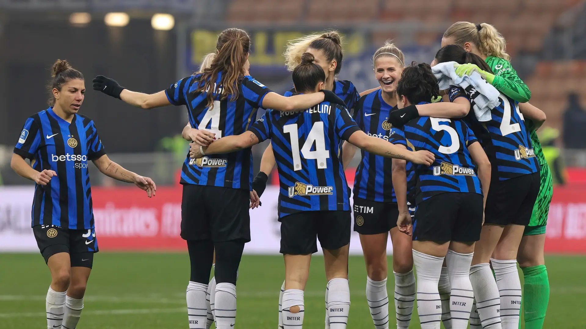 Inter Women players celebrate together on the field