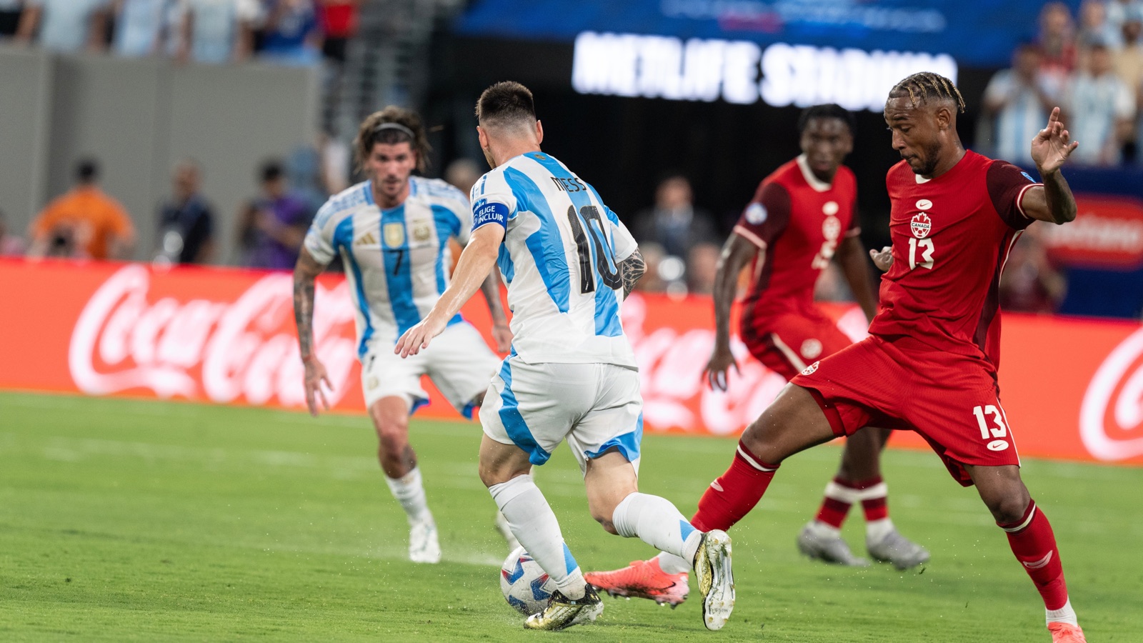Lionel Messi controls the ball for Argentina against Canada.