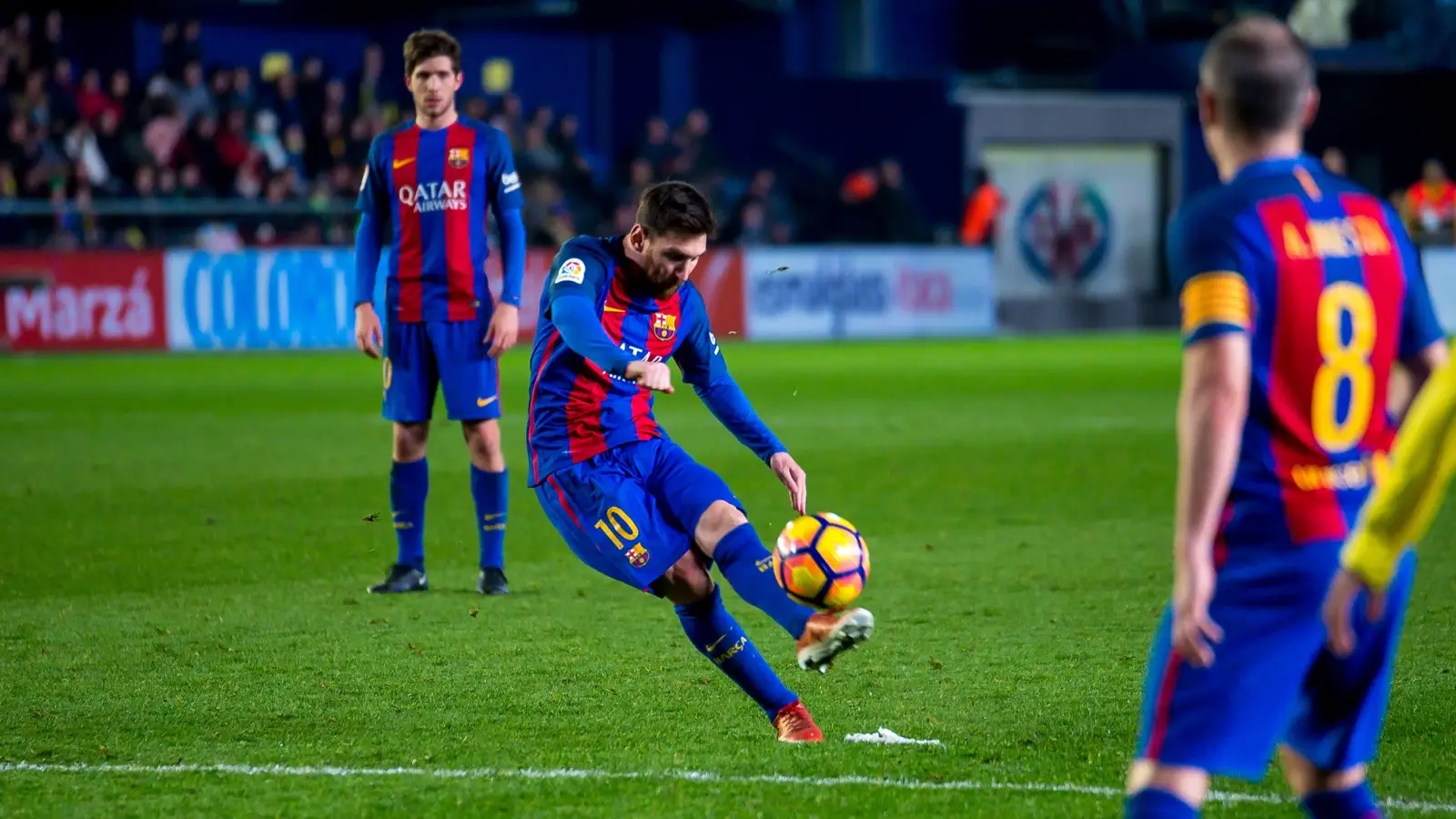 Lionel Messi strikes the ball for Barcelona during a La Liga match