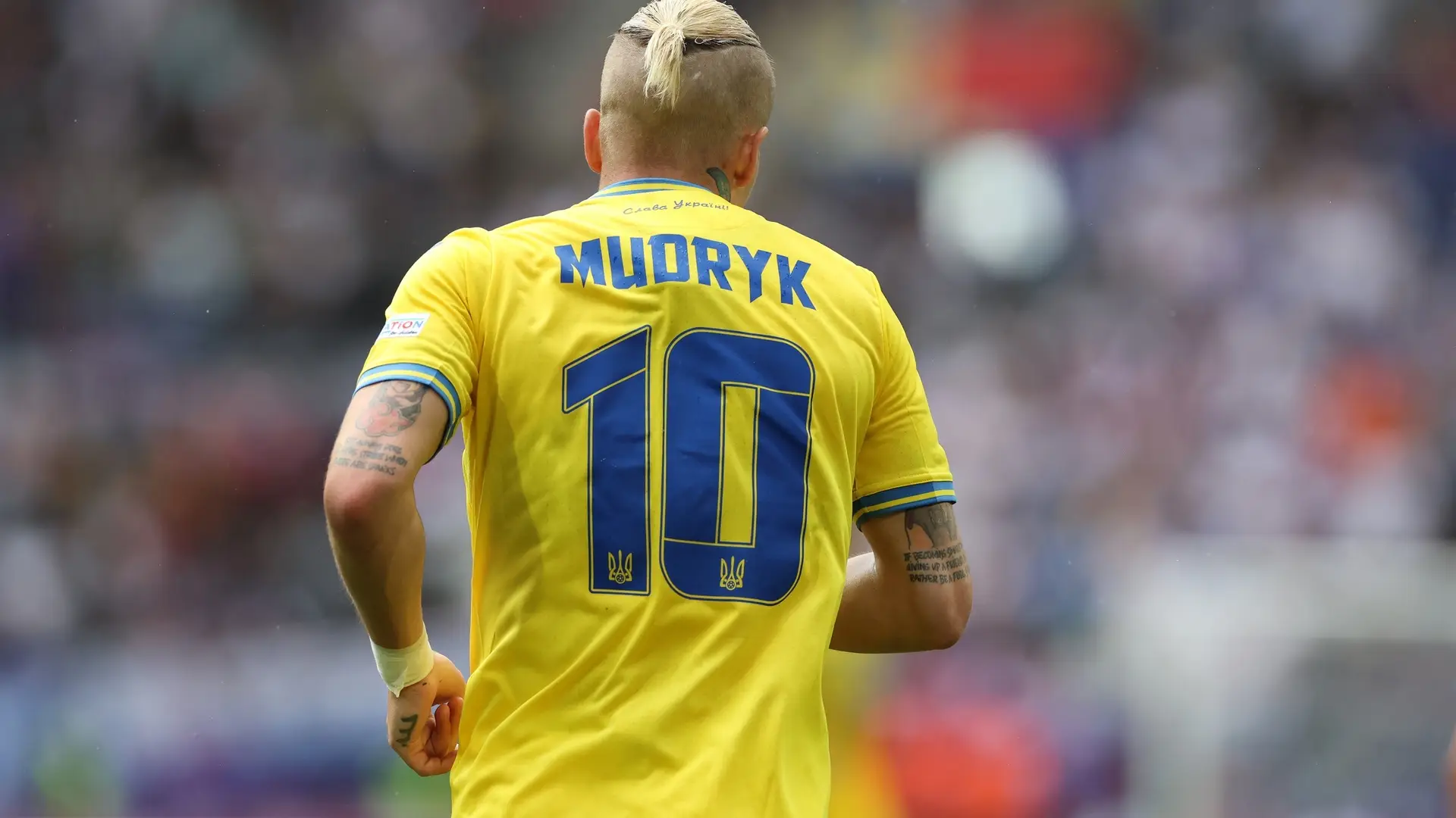 Mykhailo Mudryk wearing Ukraine’s yellow No. 10 jersey