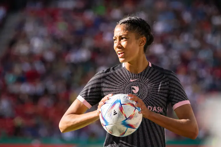 Sveindís Jónsdóttir pictured holding a soccer ball in an Angel City FC kit