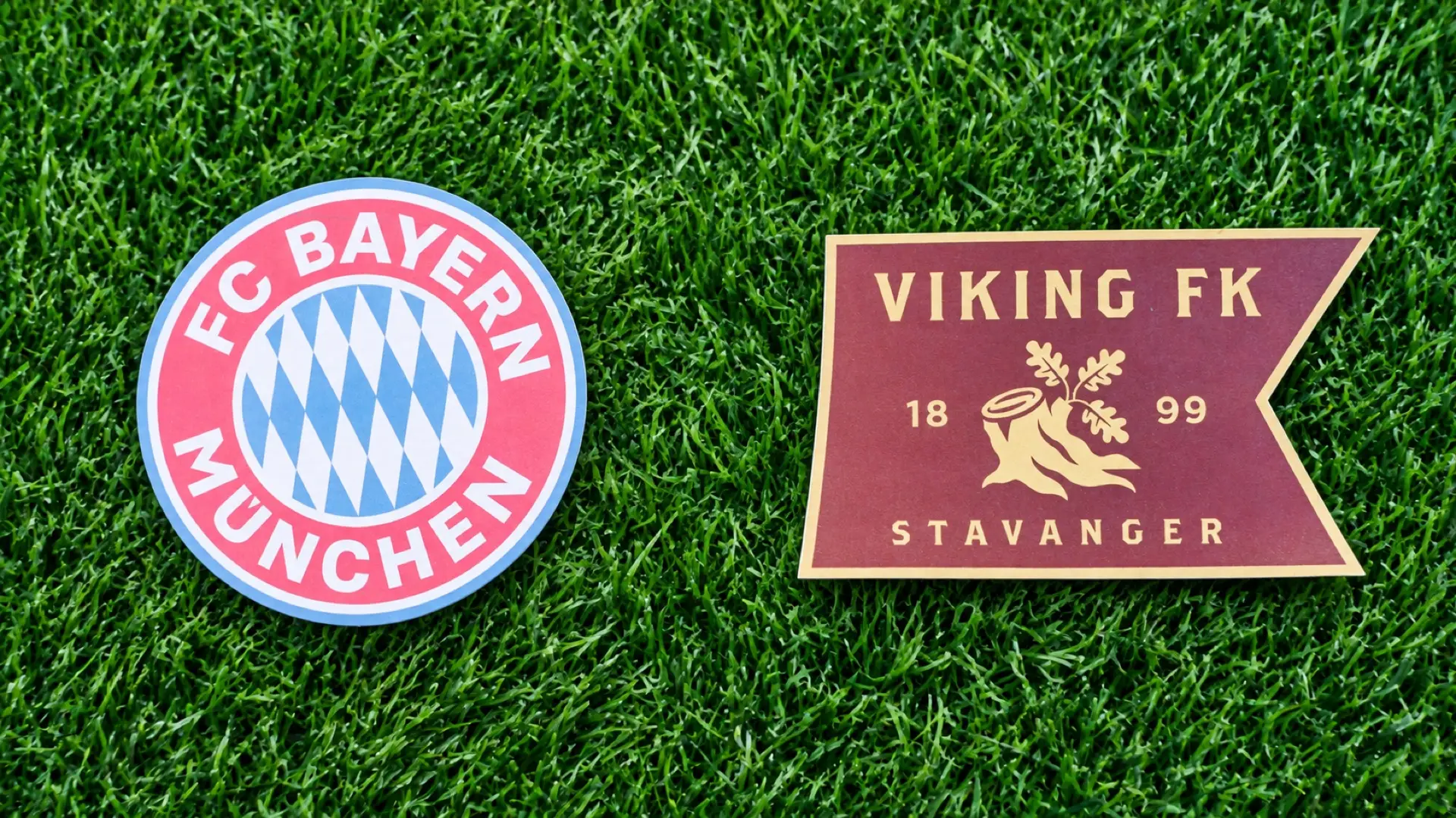 Bayern Munich and Viking FK crests side by side on grass