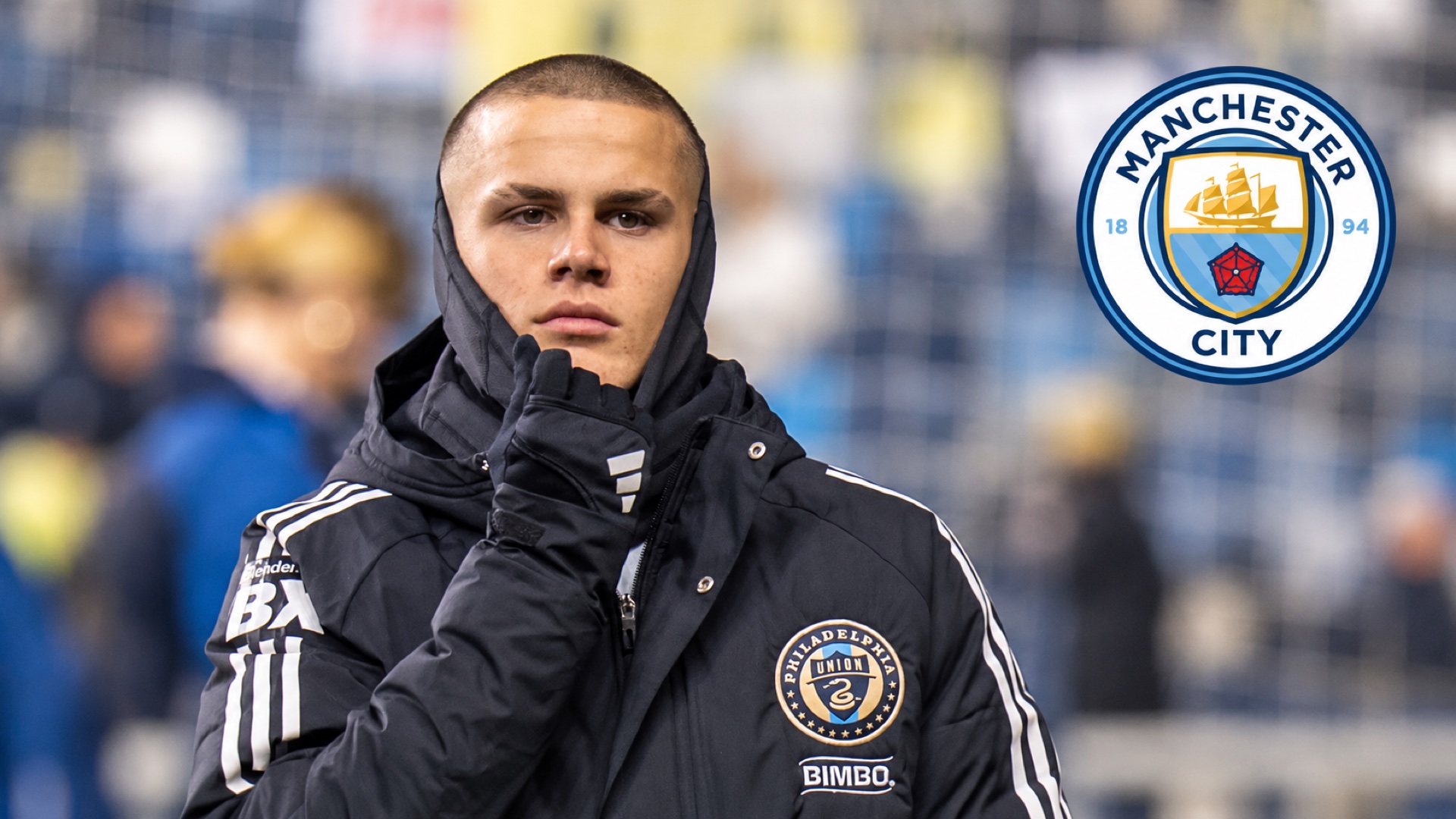 Cavan Sullivan in Philadelphia Union winter training gear with the Manchester City crest at upper right