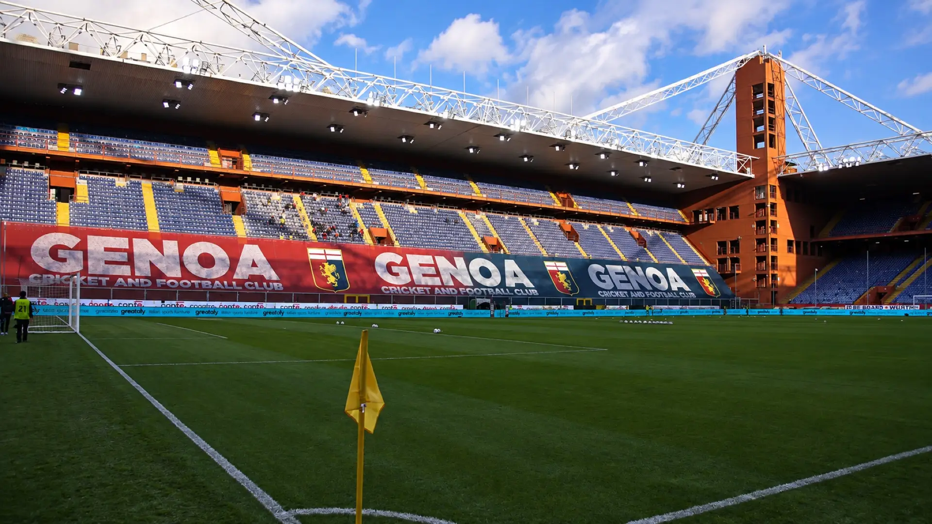 Genoa banners and club crests across the stands at Luigi Ferraris stadium