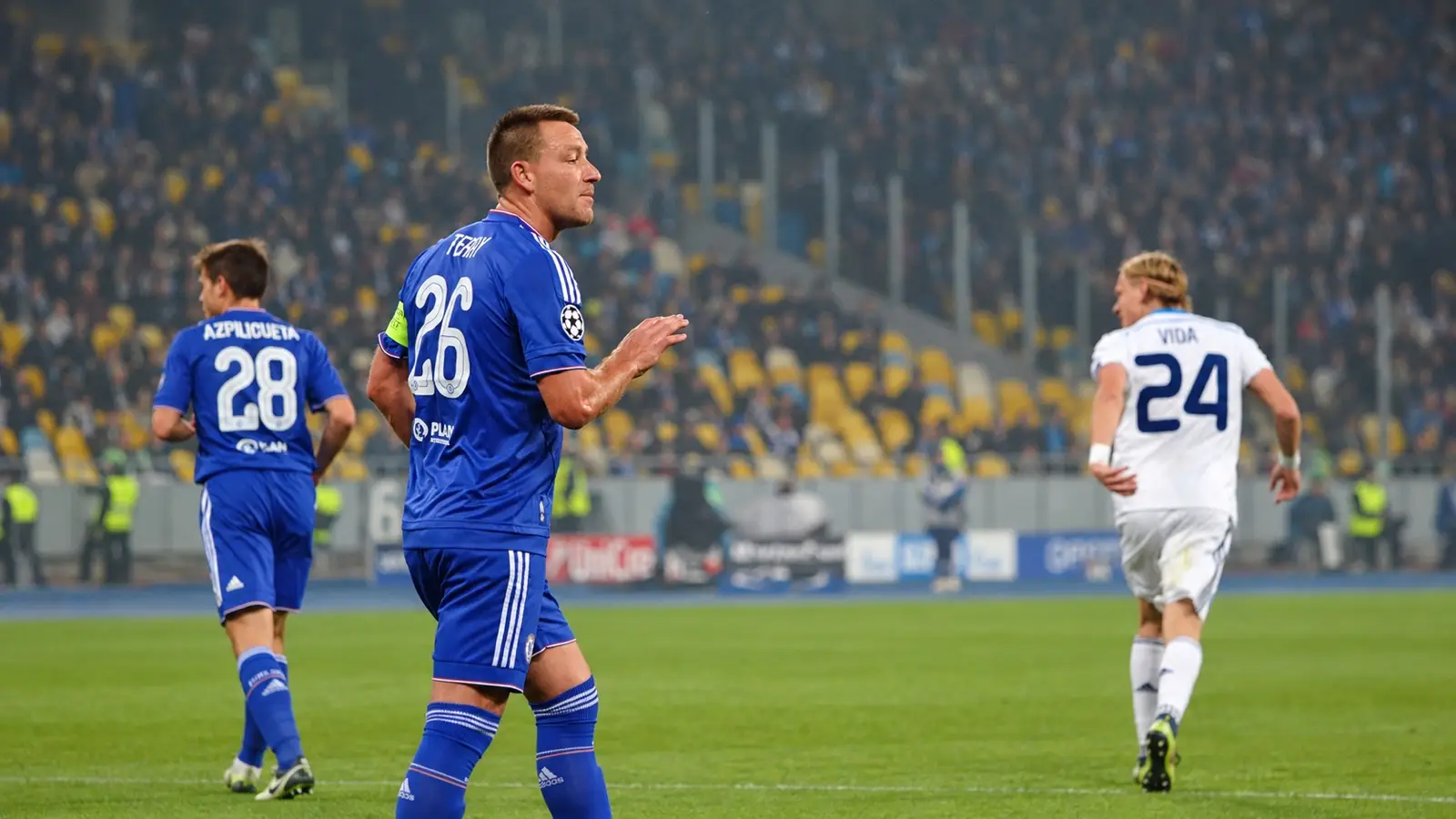 Chelsea captain John Terry in his blue number 26 shirt, with César Azpilicueta and Domagoj Vida nearby